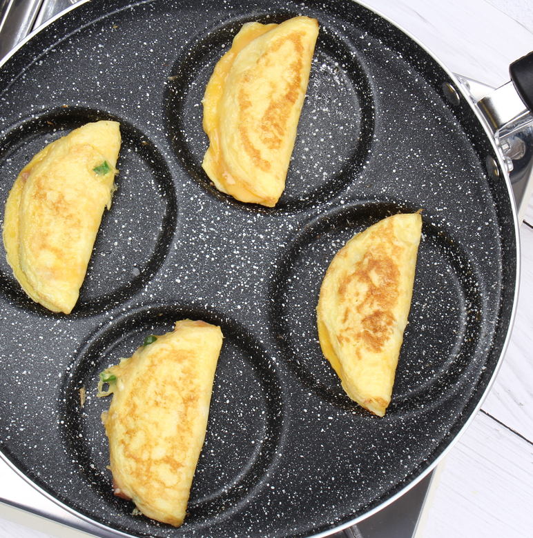 ORANGLES Nonstick Egg & Pancake Pan – 4‑Cup Gas Stove Cookware - detailed closeup view - illustrating benefits - Image 3 of 5 | created for all | Shop Nonstick Egg & Pancake Pan – 4‑Cup Gas Stove Cookware North Carolina | Free Shipping ORANGLES